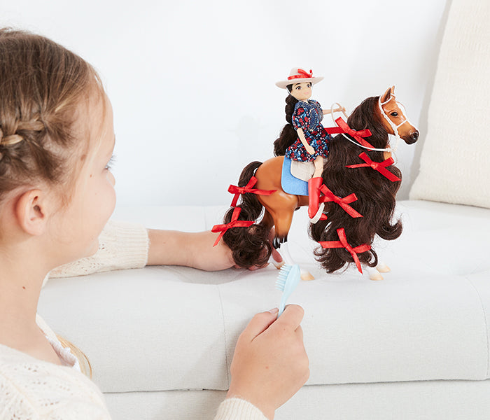The Freedom Series Collection - a child playing with models on a couch