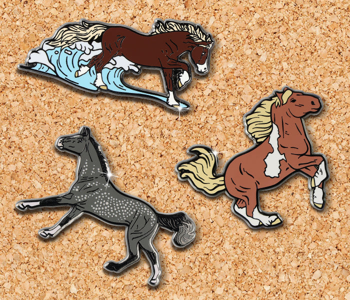 Assorted Breyer pins on a corkboard