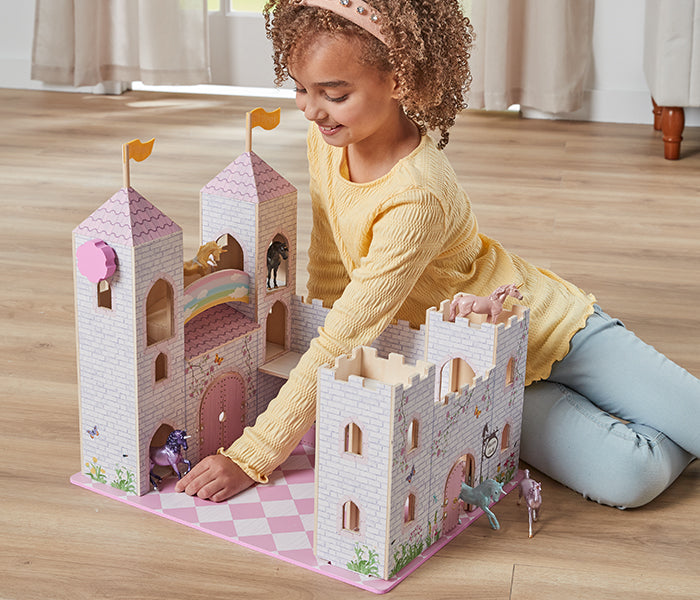 The Stablemates Collection - a child playing with the Stablemates Castle