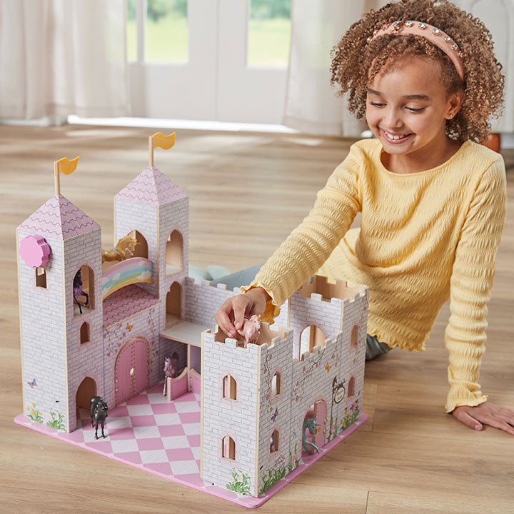 Breyer's Stablemates Collection - a child playing with the Stablemates Castle