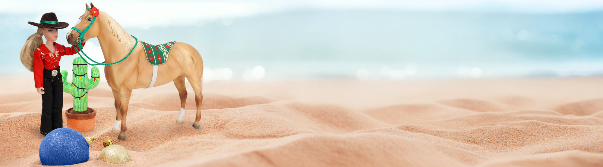 Breyer's Christmas in July featuring a Breyer Model and Figure on the sand