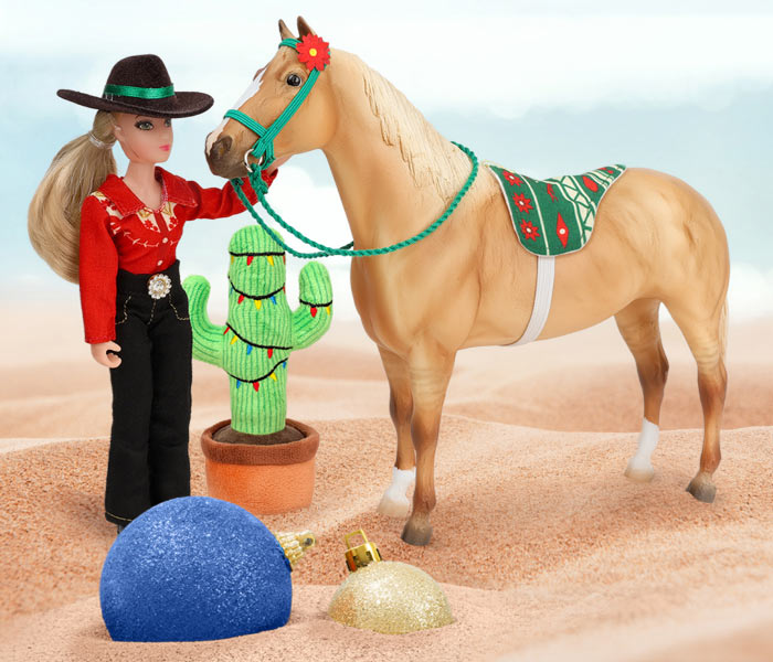 Breyer's Christmas in July featuring a Breyer Model and Figure on the sand