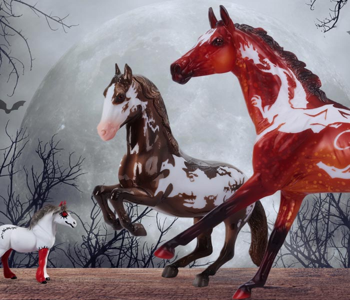 The 2026 Halloween Collection models on a creepy background with a giant moon in the background