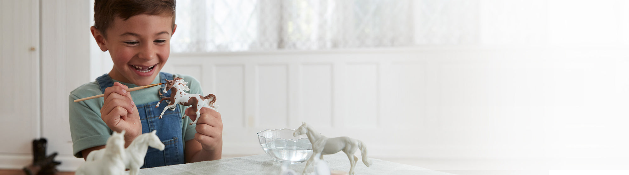 Breyer Craft Sale - featuring a child painting a Stablemate