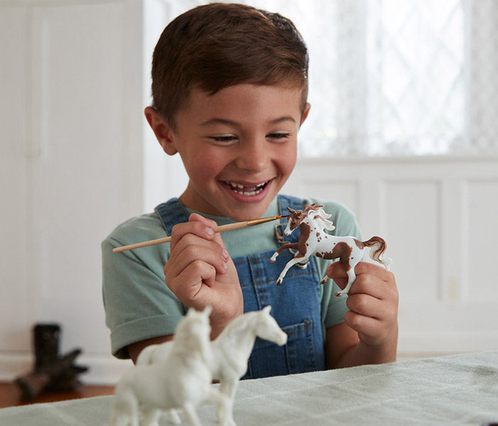Breyer Craft Sale - featuring a child painting a Stablemate