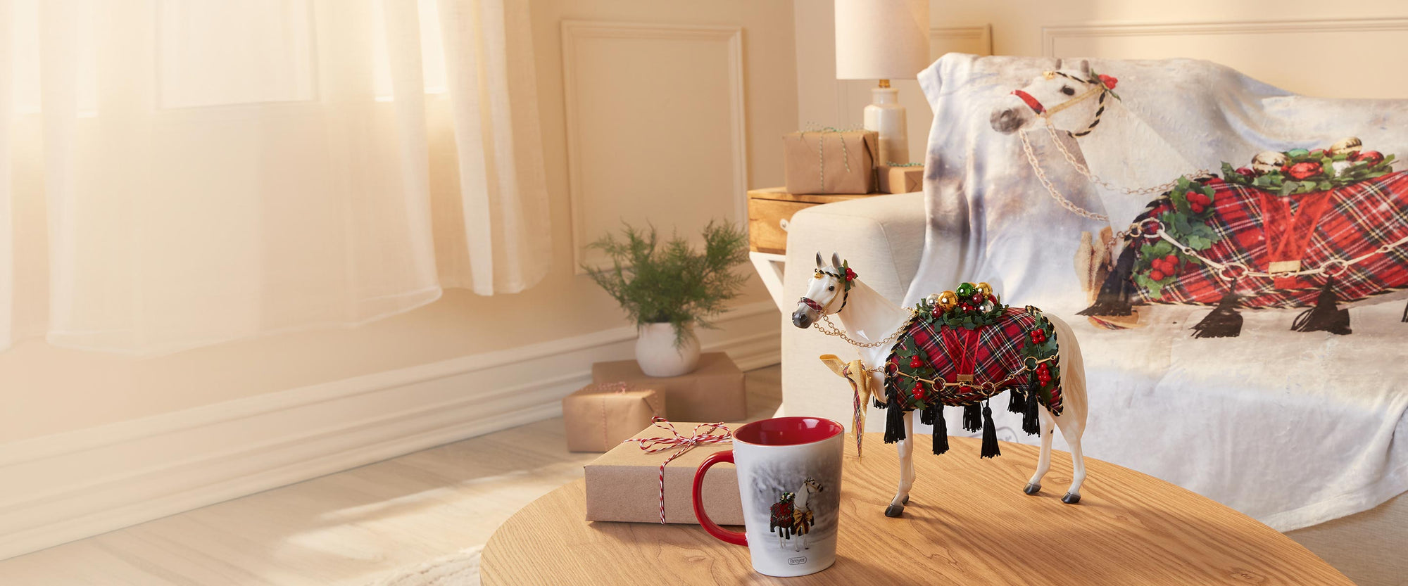 Holiday gifts by Breyer in a living room setting featuring Holiday Homecoming