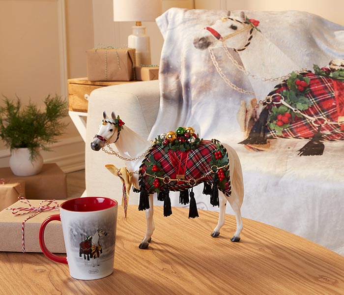 Holiday gifts by Breyer in a living room setting featuring Holiday Homecoming