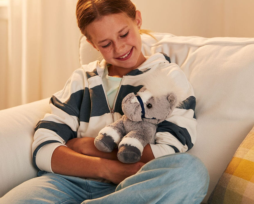 A child holding the 11" Grey Horse | Bridle Buddies