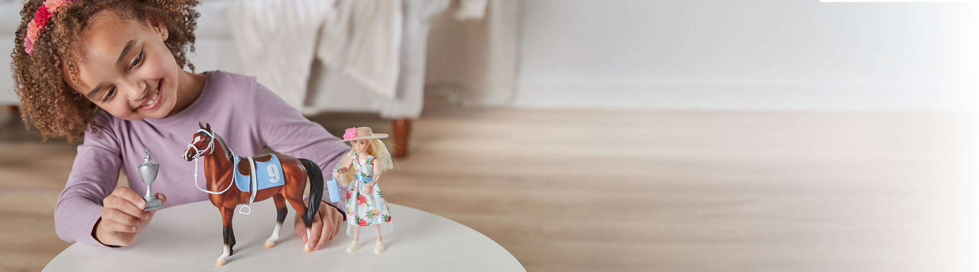 Freedom Series Sale - Save 15% - A girl playing with the Winner's Circle Play Set