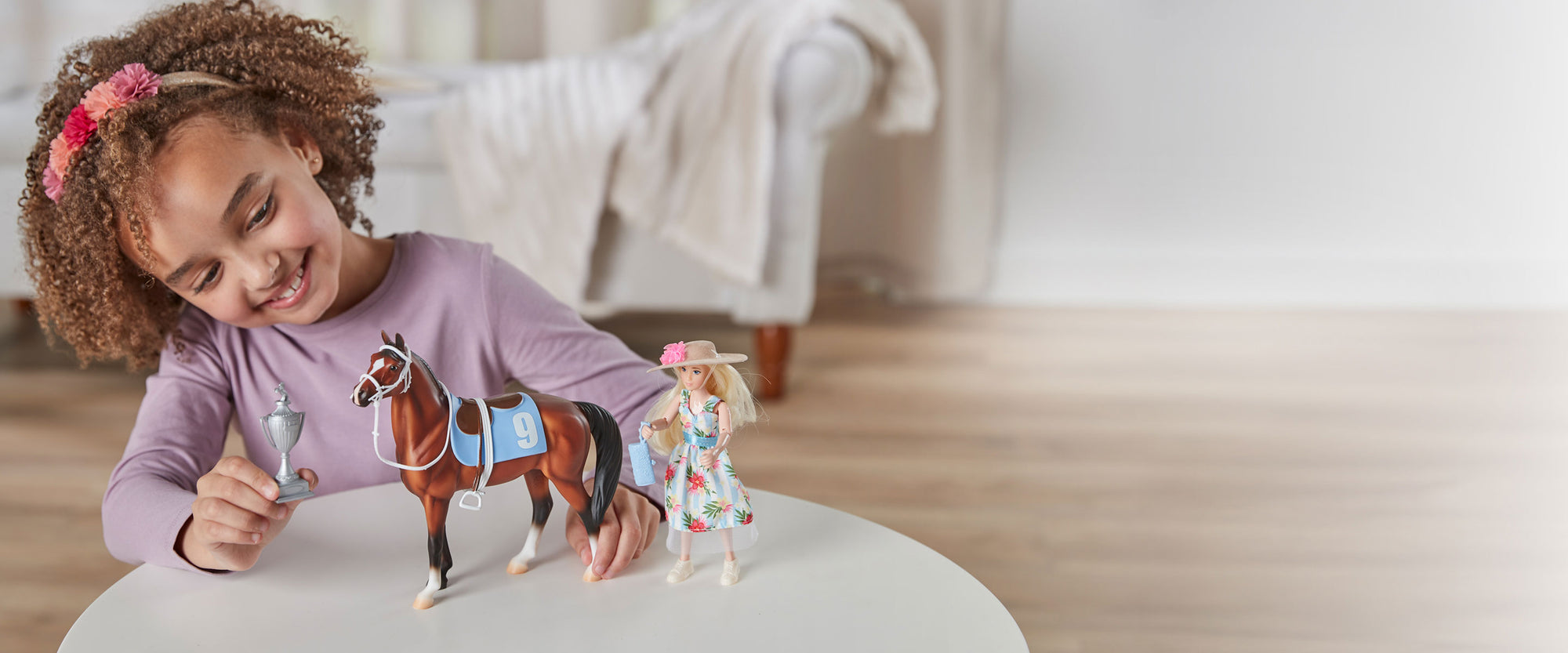 Freedom Series Sale - Save 15% - A girl playing with the Winner's Circle Play Set