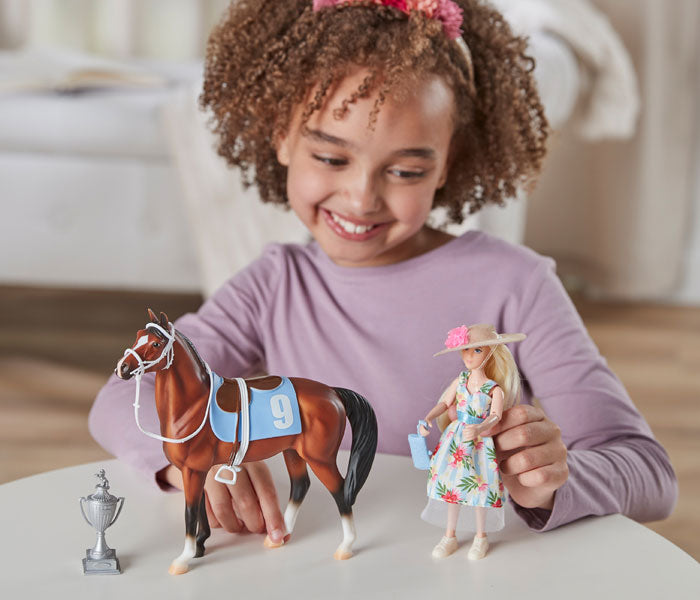 Freedom Series Sale - Save 15% - A girl playing with the Winner's Circle Play Set