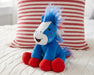 Boom | 2026 Americana Plush - facing right on a bed