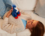 A child with Boom on a couch