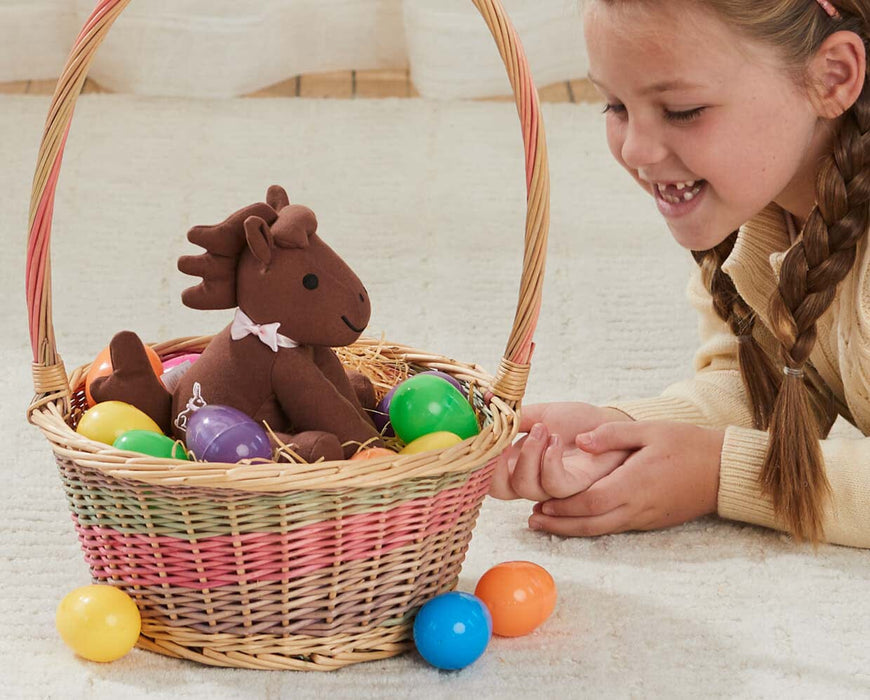 Candy | Easter Plush in an Easter basket with a child next to it on the floor