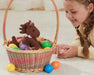 Candy | Easter Plush in an Easter basket with a child next to it on the floor
