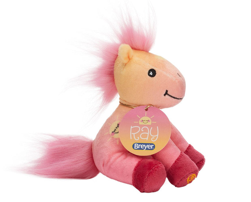 Ray featuring a pinkish-peach coat with an embroidered smiley face sun on her side
