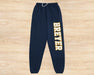 Collegiate Breyer Sweat Pants on wooden background