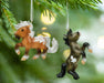 Fireheart & Mauvelous | 2026 Mini Ornament Set hanging from a tree