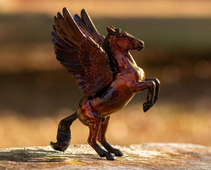Harbinger standing on a rock in an outdoor setting