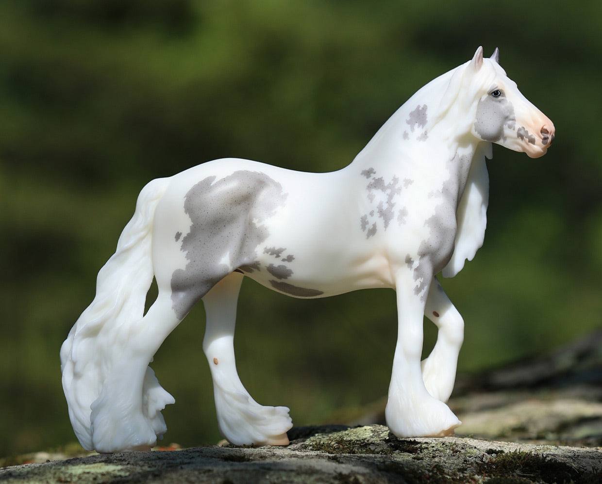 Lavinia, a 2026 Collector Club exclusive model standing on a rock