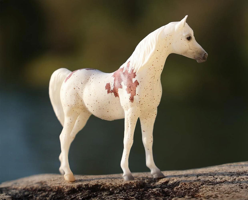 Madonna Stablemates Model - Standing on a rock in an outdoor setting