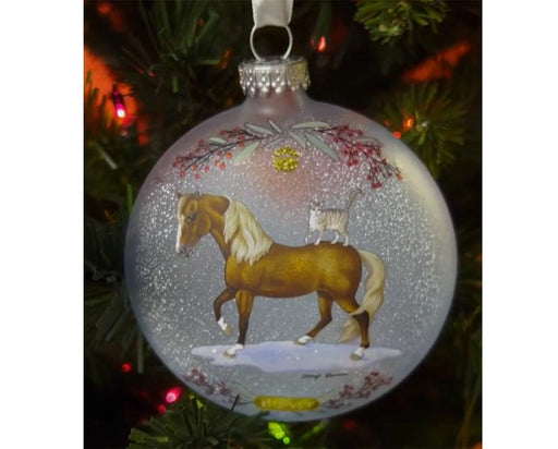 Morgan & Friends | 2025 Artist Signature Ornament hanging from a tree - side 1
