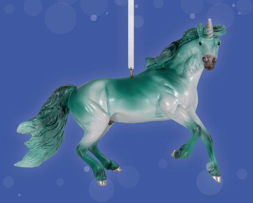 Nalu | 2025 Unicorn Ornament on blue background