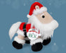 Nick | 2025 Holiday Plush facing right. Horse plush dressed in Santa clothes