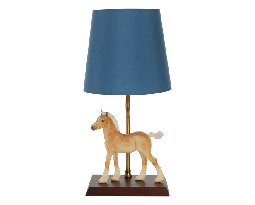 Phoebe on lamp facing left on a white background