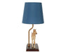 Phoebe on lamp facing forward on a white background
