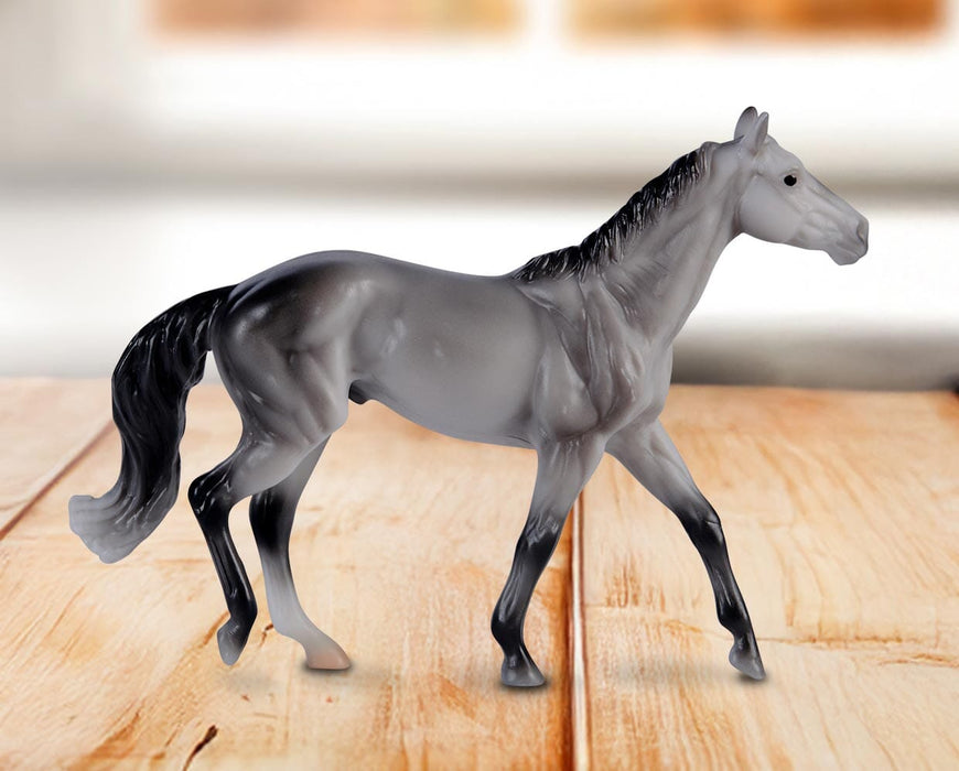 Stablemates Singles Six-Piece Assortment | Series 3 - Thoroughbred model standing on a wooden table with a window in the background