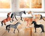 Stablemates Singles Six-Piece Assortment | Series 3 - models standing on a wooden table with a window in the background