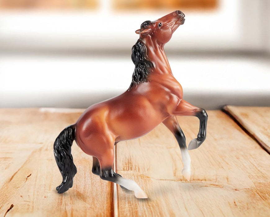 Stablemates Singles Six-Piece Assortment | Series 3 - Brumby model standing on a wooden table with a window in the background