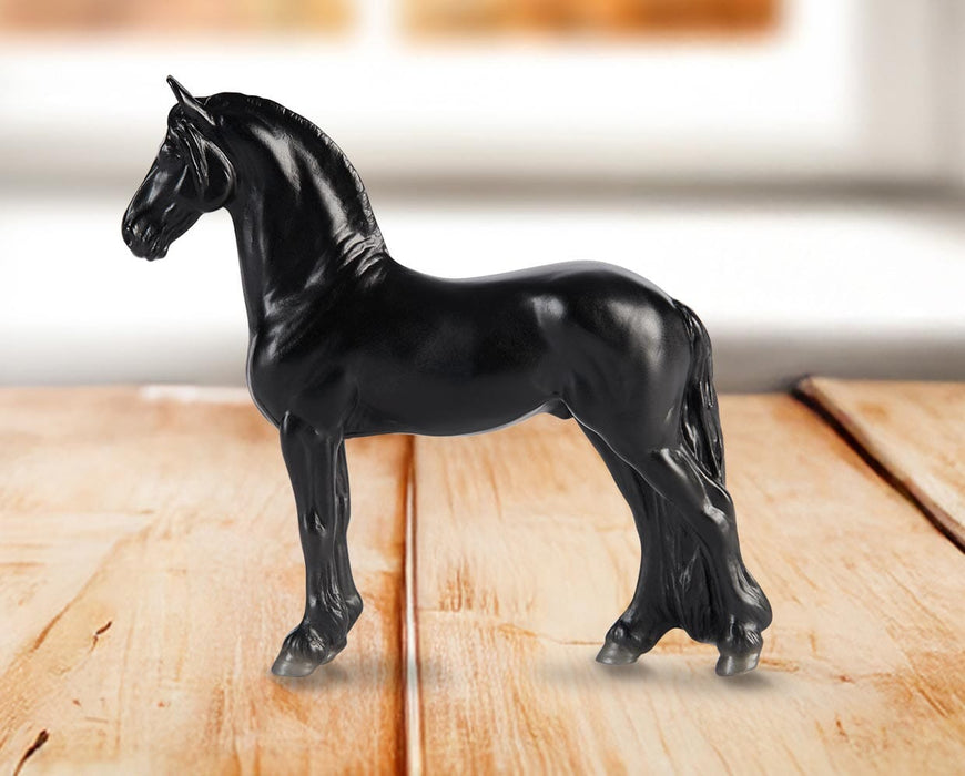 Stablemates Singles Six-Piece Assortment | Series 3 - Friesian  model standing on a wooden table with a window in the background