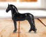 Stablemates Singles Six-Piece Assortment | Series 3 - Friesian  model standing on a wooden table with a window in the background