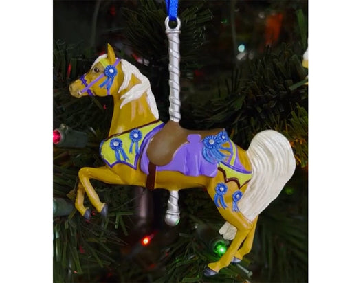 Victory | 2025 Carousel Ornament on a lighted tree