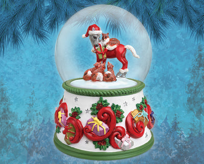 Forest Friends | Musical Snow Globe Model Breyer. On a blue holiday backgound. Inside the globe is a horse with 4 foxes
