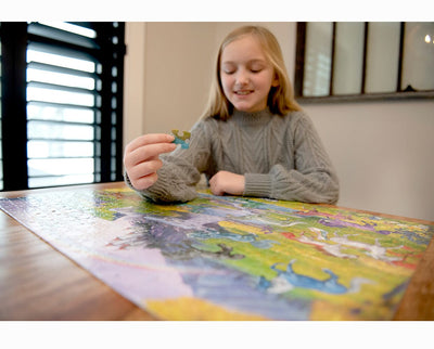 A girl playing with the Unicorn Jigsaw Puzzle